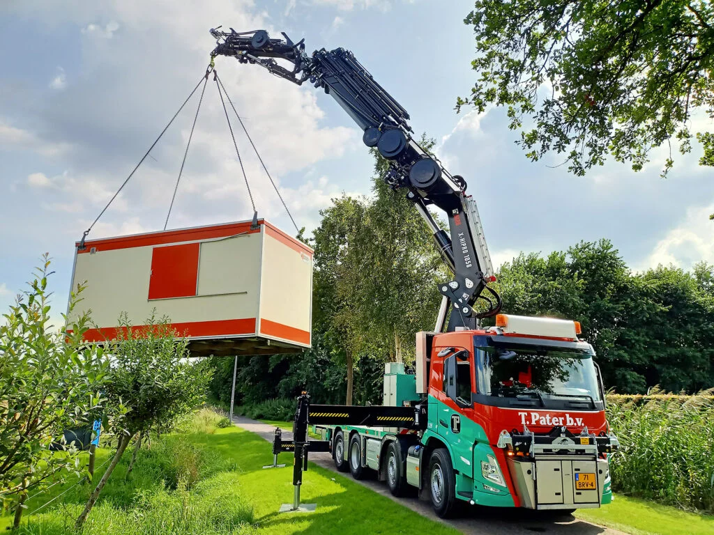 Aerial view of winding lake surrounded by dense forest